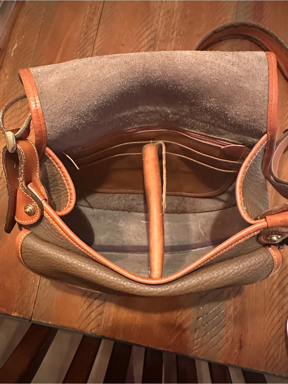 Dooney & Bourke Brown Pebbled Leather Horseshoe Crossbody with Tan Trim